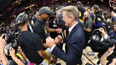 CLEVELAND, OH – JUNE 8: Head Coach Steve Kerr and Kevon Looney #5 of the Golden State Warriors celebrate after Game Four of the 2018 NBA Finals against the Cleveland Cavaliers on June 8, 2018 at Quicken Loans Arena in Cleveland, Ohio. NOTE TO USER: User expressly acknowledges and agrees that, by downloading and or using this Photograph, user is consenting to the terms and conditions of the Getty Images License Agreement. Mandatory Copyright Notice: Copyright 2018 NBAE (Photo by Andrew D. Bernstein/NBAE via Getty Images)