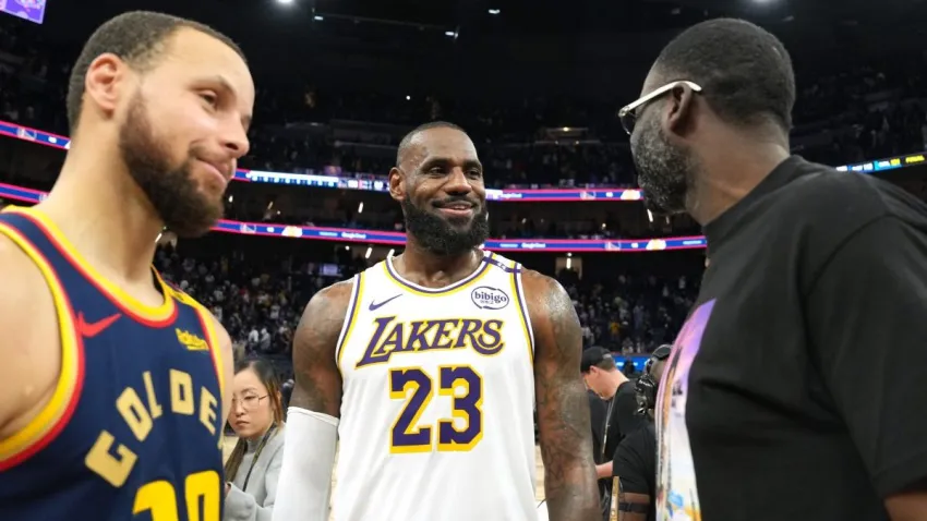 Jan 25, 2025; San Francisco, California, USA; Los Angeles Lakers forward LeBron James (23) talks with Golden State Warriors guard Stephen Curry (30) and forward Draymond Green (right) after the game at Chase Center. Mandatory Credit: Darren Yamashita-Imagn Images