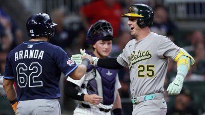 ATLANTA, GEORGIA – JULY 15: Brent Rooker #25 of the Athletics celebrates after his three-run home run against the National League with Jonathan Aranda #62 of the Tampa Bay Rays during the seventh inning of the MLB All-Star Game at Truist Park on July 15, 2025 in Atlanta, Georgia. (Photo by Jamie Squire/Getty Images)