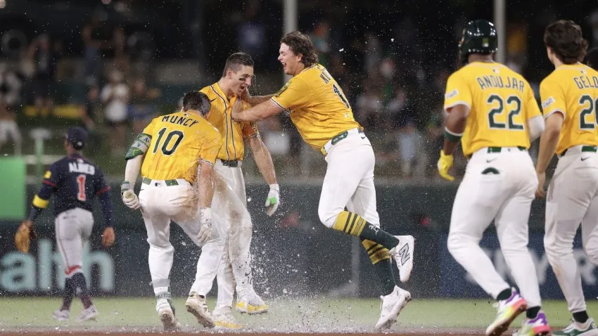 SACRAMENTO, CALIFORNIA – JULY 10: Tyler Soderstrom #21 of the Athletics celebrates with Max Muncy #10 and Nick Kurtz #16 after hitting an RBI single for a walk-off win against the Atlanta Braves during the 11th inning at Sutter Health Park on July 10, 2025 in Sacramento, California. (Photo by Kelley L Cox/Getty Images)
