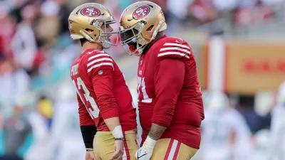 Dec 4, 2022; Santa Clara, California, USA; San Francisco 49ers quarterback Brock Purdy (13) celebrates with offensive tackle Trent Williams (71) after a touchdown during the second quarter at Levi’s Stadium. Mandatory Credit: Sergio Estrada-USA TODAY Sports