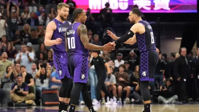Apr 11, 2025; Sacramento, California, USA; Sacramento Kings forward DeMar DeRozan (10) talks with forward Domantas Sabonis (left) and guard Zach LaVine (8) during the fourth quarter against the Los Angeles Clippers at Golden 1 Center. Mandatory Credit: Darren Yamashita-Imagn Images