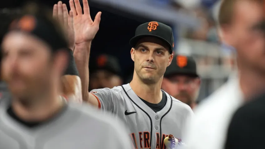 May 30, 2025; Miami, Florida, USA;  San Francisco Giants pitcher Tyler Rogers (71) gets high-fives after shutting down the Marlins in the seventh inning at loanDepot Park. Mandatory Credit: Jim Rassol-Imagn Images