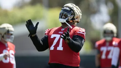 Jun 10, 2025; Santa Clara, CA, USA; San Francisco 49ers offensive tackle Trent Williams (71) reacts to a blocking drill during an OTA at Levi’s Stadium. Mandatory Credit: D. Ross Cameron-Imagn Images