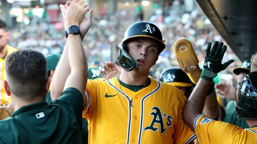 Aug 2, 2025; West Sacramento, California, USA; Athletics first baseman Nick Kurtz (16) is congratulated by teammates after scoring a run against the Arizona Diamondbacks during the third inning at Sutter Health Park. Mandatory Credit: Dennis Lee-Imagn Images