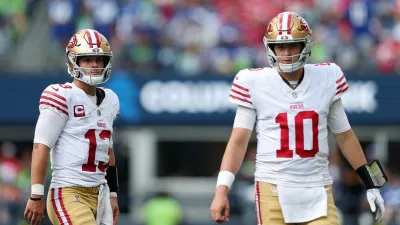 SEATTLE, WASHINGTON – SEPTEMBER 07: Brock Purdy #13 and Mac Jones #10 of the San Francisco 49ers looks on during the third quarter against the Seattle Seahawks during the game at Lumen Field on September 07, 2025 in Seattle, Washington. (Photo by Steph Chambers/Getty Images)