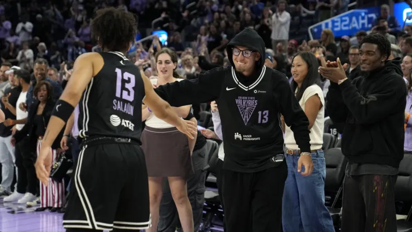 SAN FRANCISCO, CA – JULY 25: Janelle Salaun #13 of the Golden State Valkyries high fives Brandin Podziemski after the game against the Dallas Wings during a WNBA game on July 25, 2025 at Chase Center in San Francisco, California. NOTE TO USER: User expressly acknowledges and agrees that, by downloading and or using this photograph, user is consenting to the terms and conditions of Getty Images License Agreement. Mandatory Copyright Notice: Copyright 2025 NBAE (Photo by Andreea Cardani/NBAE via Getty Images)