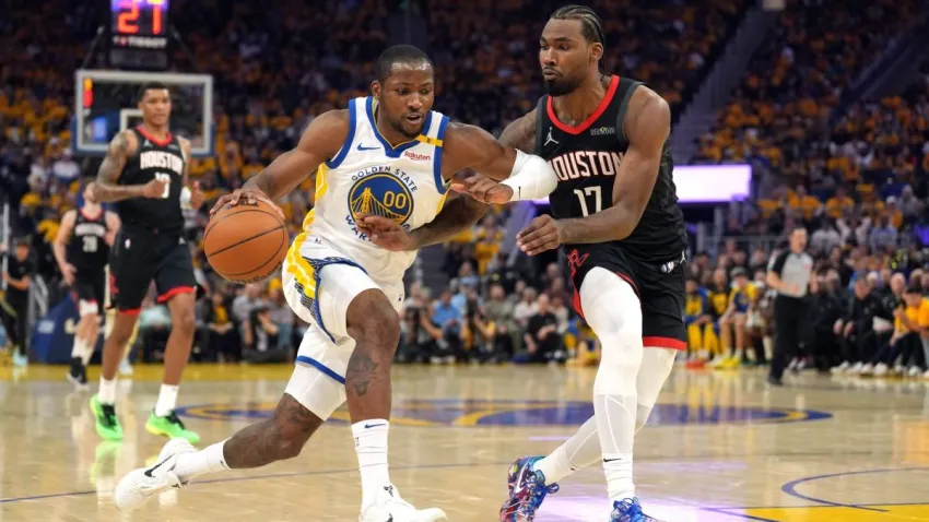 Apr 26, 2025; San Francisco, California, USA; Golden State Warriors forward Jonathan Kuminga (00) dribbles against Houston Rockets forward Tari Eason (17) during the second quarter of game three of first round for the 2024 NBA Playoffs at Chase Center. Mandatory Credit: Darren Yamashita-Imagn Images