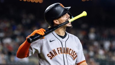 Sep 16, 2025; Phoenix, Arizona, USA; San Francisco Giants shortstop Willy Adames bites his bat as he reacts after striking out in the first inning against the Arizona Diamondbacks at Chase Field. Mandatory Credit: Mark J. Rebilas-Imagn Images