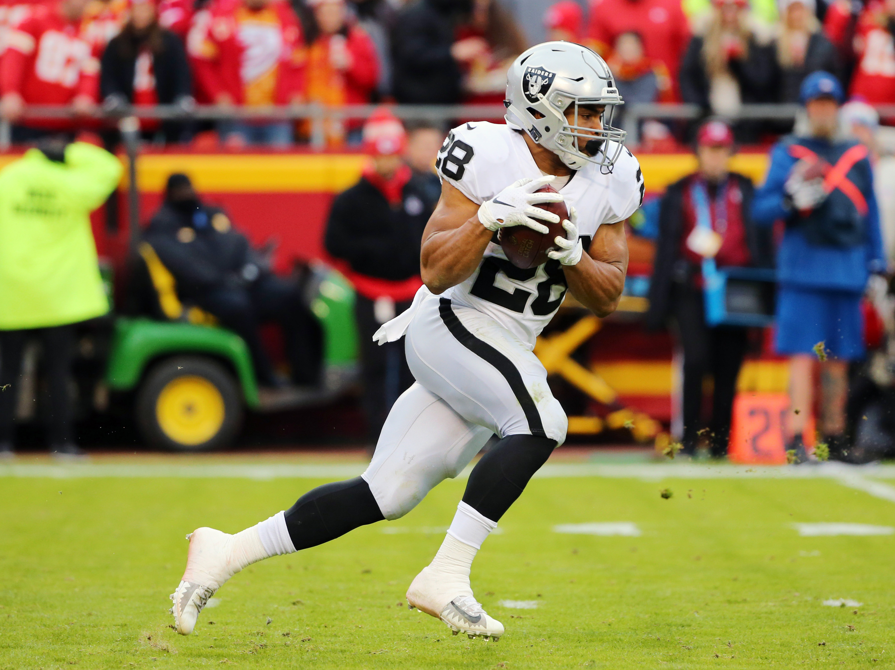 Dec 30, 2018; Kansas City, MO, USA; Oakland Raiders running back Doug Martin (28) runs against the Kansas City Chiefs in the first half at Arrowhead Stadium. Mandatory Credit: Jay Biggerstaff-USA TODAY Sports