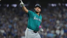 Oct 19, 2025; Toronto, Ontario, CAN; Seattle Mariners first baseman Josh Naylor (12) reacts after hitting a home run in the sixth inning against the Toronto Blue Jays during game six of the ALCS round for the 2025 MLB playoffs at Rogers Centre. Mandatory Credit: Nick Turchiaro-Imagn Images