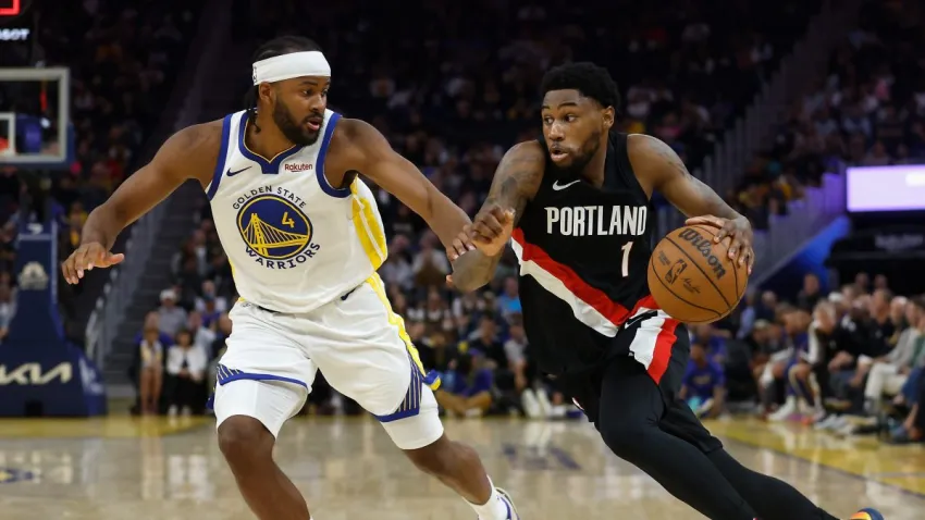 SAN FRANCISCO, CALIFORNIA – OCTOBER 08: Blake Wesley #1 of the Portland Trail Blazers drives to the basket against Moses Moody #4 of the Golden State Warriors in the third quarter at Chase Center on October 08, 2025 in San Francisco, California. NOTE TO USER: User expressly acknowledges and agrees that, by downloading and or using this photograph, User is consenting to the terms and conditions of the Getty Images License Agreement. (Photo by Lachlan Cunningham/Getty Images)