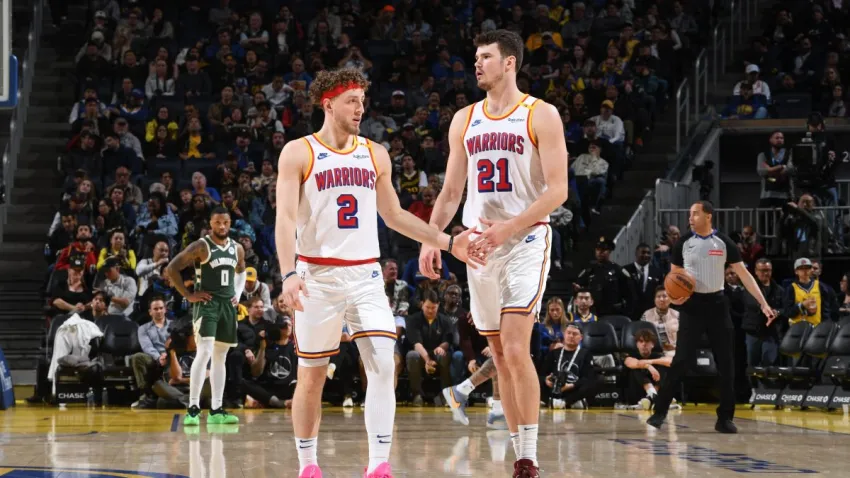 SAN FRANCISCO, CA – MARCH 18:  Brandin Podziemski #2 and Quinten Post #21 of the Golden State Warriors high five during the game against the Milwaukee Bucks on March 18, 2025 at Chase Center in San Francisco, California. NOTE TO USER: User expressly acknowledges and agrees that, by downloading and or using this photograph, user is consenting to the terms and conditions of Getty Images License Agreement. Mandatory Copyright Notice: Copyright 2025 NBAE (Photo by Noah Graham/NBAE via Getty Images)