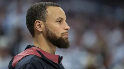 May 8, 2025; Minneapolis, Minnesota, USA; Golden State Warriors guard Stephen Curry (30) looks on from the bench against the Minnesota Timberwolves in the second half during game two of the second round for the 2025 NBA Playoffs at Target Center. Mandatory Credit: Jesse Johnson-Imagn Images