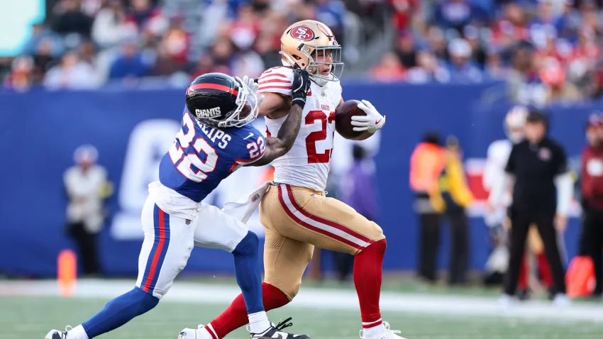 EAST RUTHERFORD, NEW JERSEY – NOVEMBER 2: Christian McCaffrey #23 of the San Francisco 49ers runs with the ball against Dru Phillips #22 of the New York Giants during the third quarter at MetLife Stadium on November 2, 2025 in East Rutherford, New Jersey. (Photo by Kathryn Riley/Getty Images)