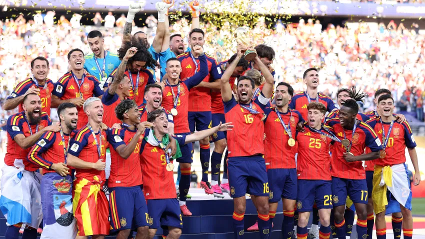 :Rodri #16 of Spain lifts the FIFA World Cup Winner’s Trophy after the team’s victory.