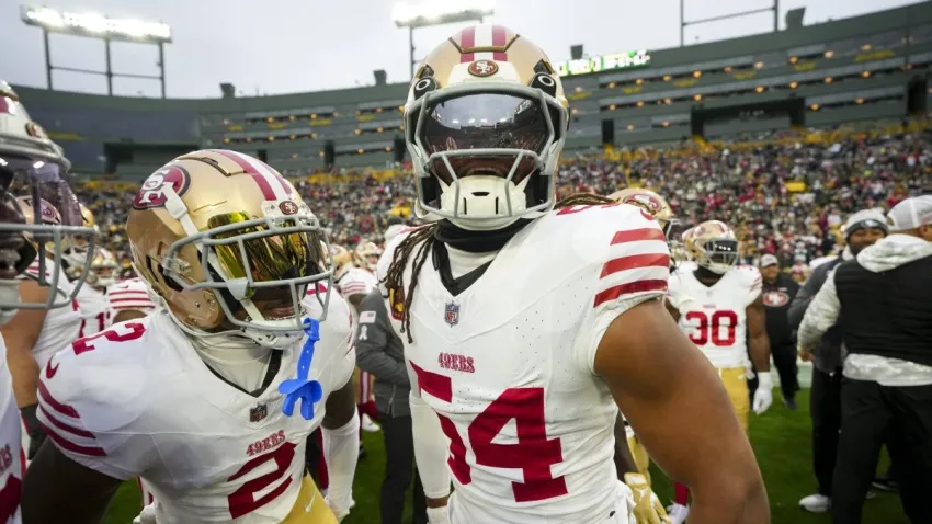 GREEN BAY, WISCONSIN – NOVEMBER 24: Cornerback Deommodore Lenoir #2 of the San Francisco 49ers and linebacker Fred Warner #54 interact prior to an NFL football game against the Green Bay Packers, at Lambeau Field on November 24, 2024 in Green Bay, Wisconsin. (Photo by Todd Rosenberg/Getty Images)