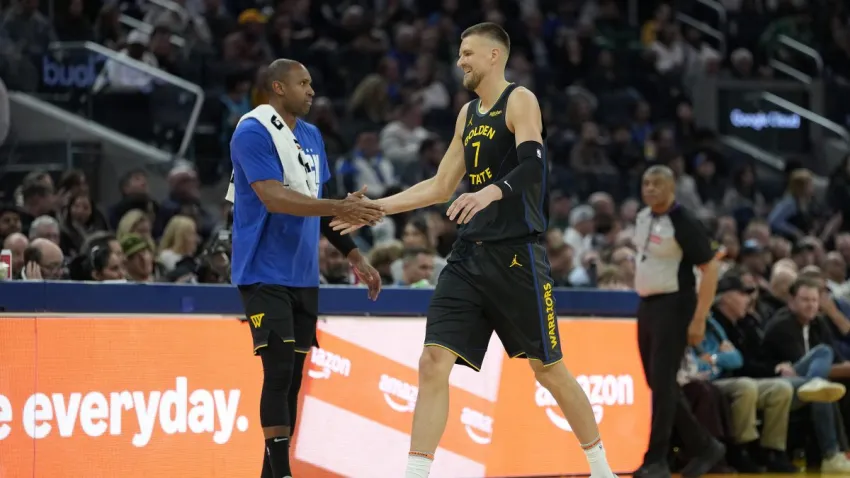 SAN FRANCISCO, CALIFORNIA – FEBRUARY 19: Kristaps Porzingis #7 of the Golden State Warriors walking off the court slaps hands with teammate Al Horford #20 against the Boston Celtics in the first half at Chase Center on February 19, 2026 in San Francisco, California. NOTE TO USER: User expressly acknowledges and agrees that, by downloading and or using this photograph, User is consenting to the terms and conditions of the Getty Images License Agreement. (Photo by Thearon W. Henderson/Getty Images)