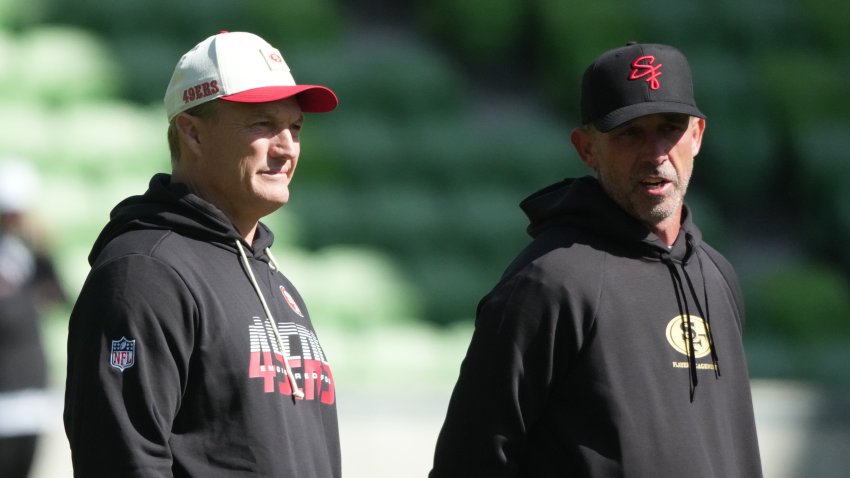 Sep 9, 2026; Melbourne, Victoria, Australia; San Francisco 49ers head coach Kyle Shanahan (right) and general manager John Lynch at practice at AAMI Park. Mandatory Credit: Kirby Lee-Imagn Images