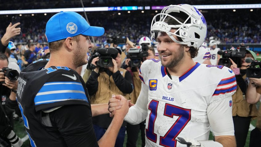 Jared Goff of the Detroit Lions shakes hands with Josh Allen of the Buffalo Bills