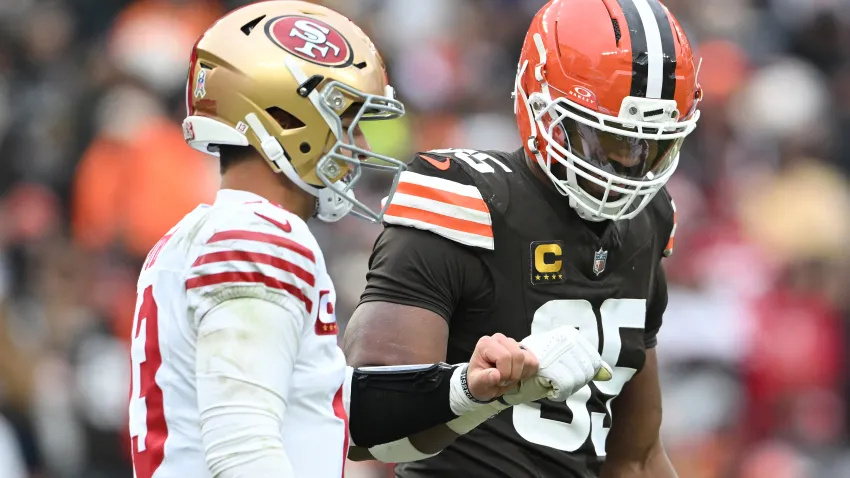 CLEVELAND, OHIO – NOVEMBER 30: Brock Purdy #13 of the San Francisco 49ers and Myles Garrett #95 of the Cleveland Browns fist bump after a play in the third quarter of a game at Huntington Bank Field on November 30, 2025 in Cleveland, Ohio. (Photo by Nick Cammett/Getty Images)