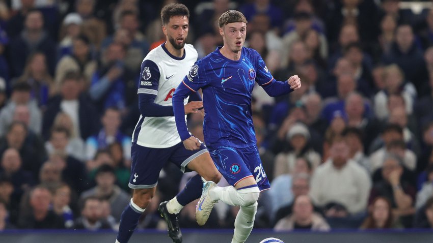 Cole Palmer of Chelsea takes the ball past Rodrigo Bentancur of Tottenham.