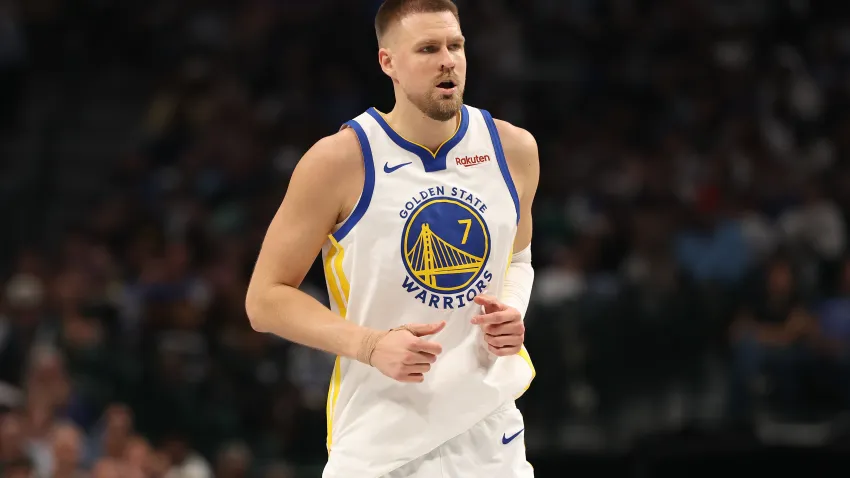 DALLAS, TEXAS – MARCH 23: Kristaps Porzingis #7 of the Golden State Warriors looks on during the first half against the Dallas Mavericks at American Airlines Center on March 23, 2026 in Dallas, Texas. NOTE TO USER: User expressly acknowledges and agrees that, by downloading and or using this photograph, user is consenting to the terms and conditions of the Getty Images License Agreement. (Photo by Sam Hodde/Getty Images)