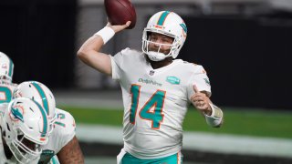 Dec 26, 2020; Paradise, Nevada, USA; Miami Dolphins quarterback Ryan Fitzpatrick (14) throws a pass in the fourth quarter against the Las Vegas Raidersat Allegiant Stadium. The Dolphins defeated the Raiders 26-25. Mandatory Credit: Kirby Lee-USA TODAY Sports